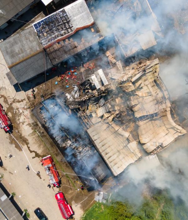 aerial-view-of-firefighters-extinguishing-ruined-b-2023-11-27-05-06-05-utc