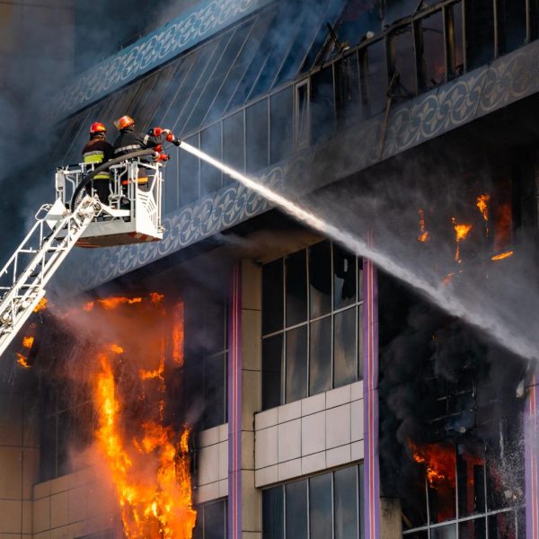 closeup-of-firefighters-on-the-stairs-extinguish-a-2023-11-27-04-45-21-utc