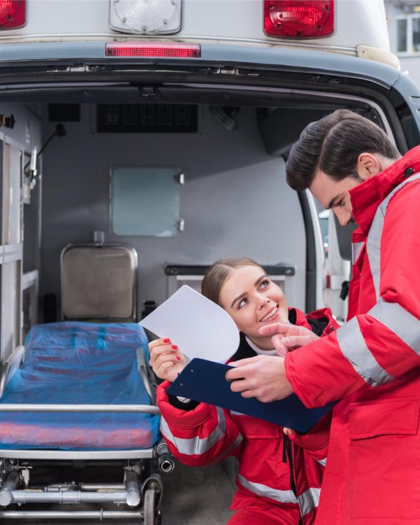 happy-male-and-female-paramedics-reading-documents-2023-11-27-05-22-15-utc (1)