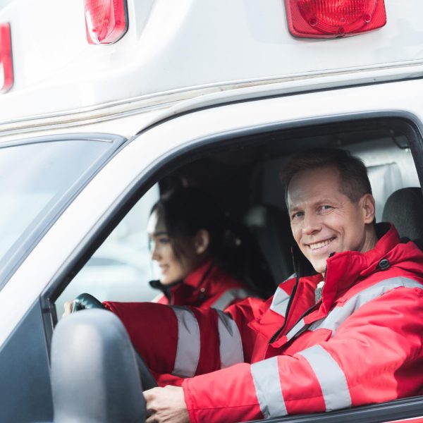 happy-male-and-female-paramedics-sitting-in-ambula-2023-11-27-05-24-39-utc (1)