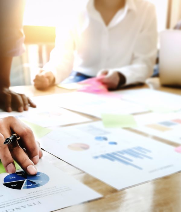 Businessman,Holding,Pens,And,Holding,Graph,Paper,Are,Meeting,To